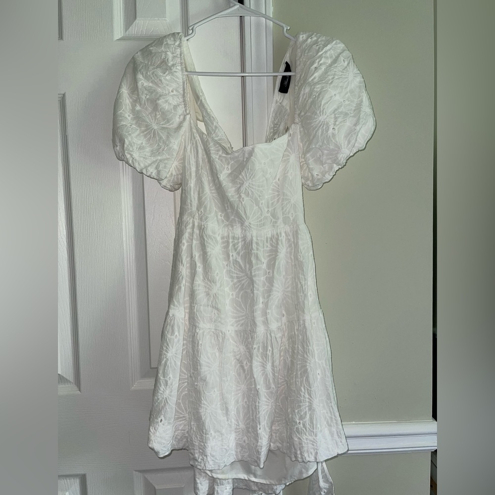 White eye-lit mini dress